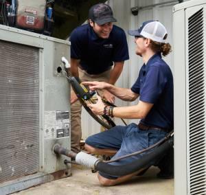 HVAC Technicians Fixing an HVAC Unit