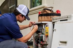 HVAC Technician Working on HVAC Wiring